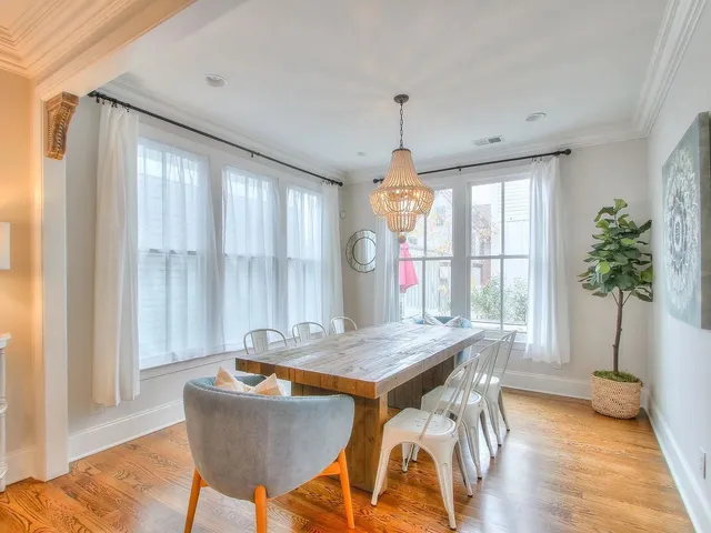 a dining room with a table and chairs