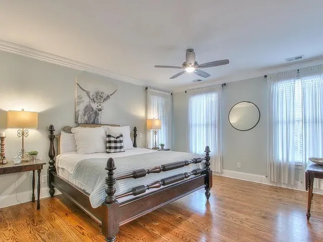 a bedroom with a bed and window