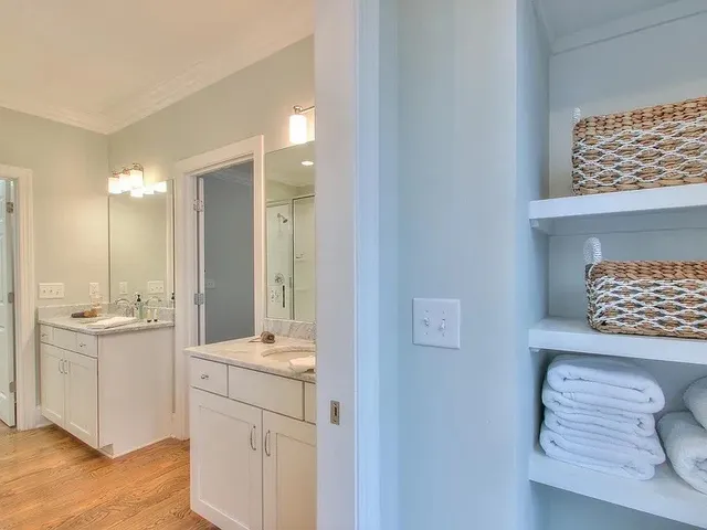 a view of walk in closet with empty racks