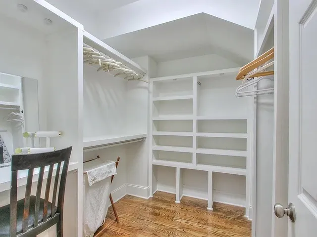 a bedroom with a bed and a lamp