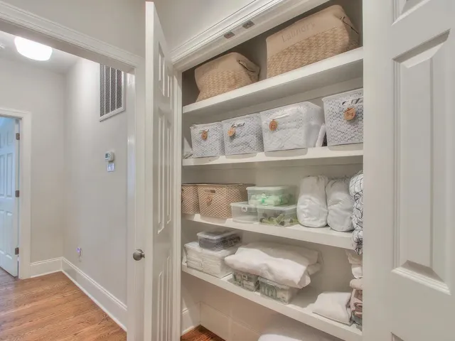 a bedroom with bed and wooden floor