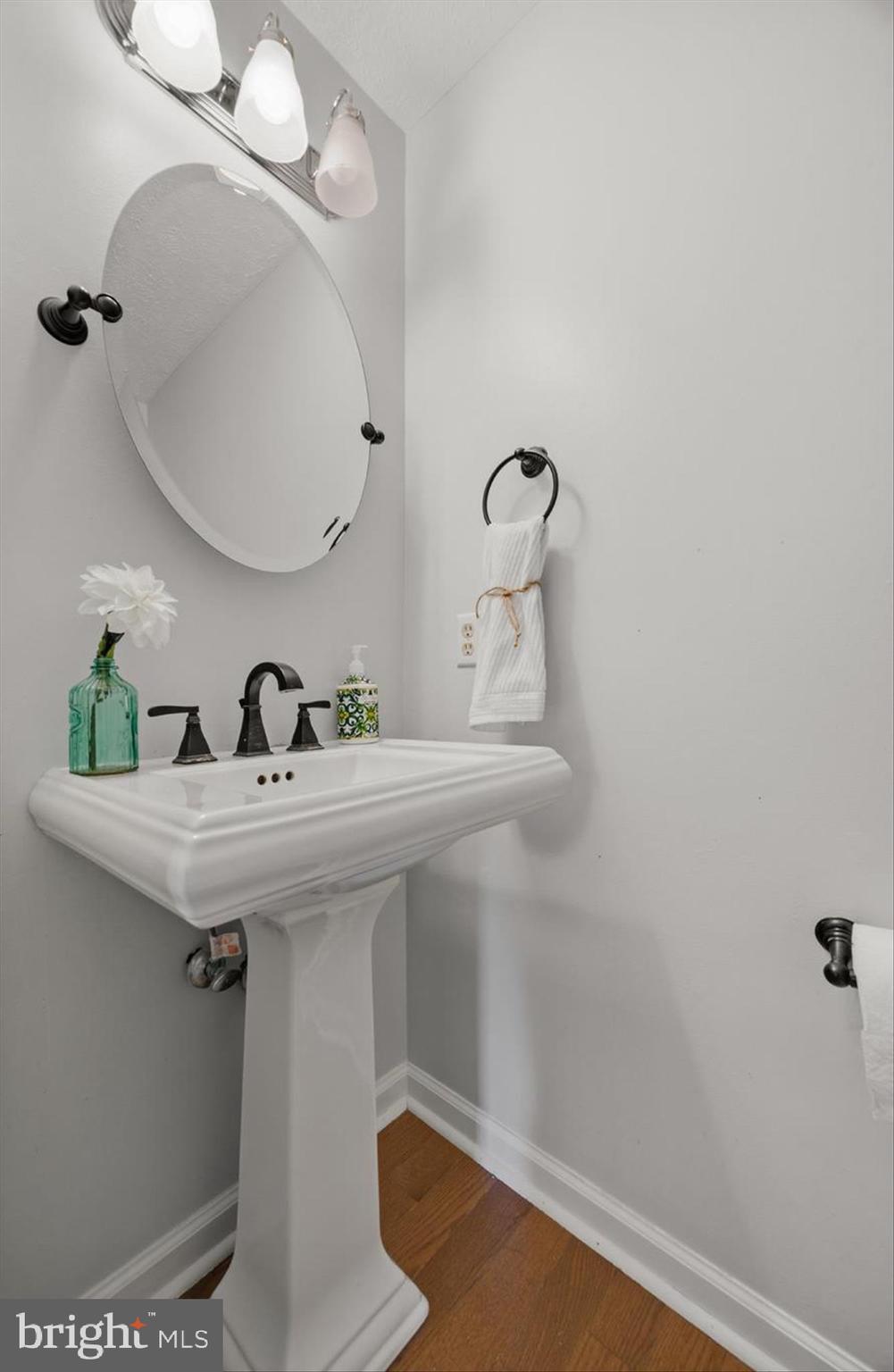 1506 Gollum Road Hanover, MD 21076 - Photo 19 of 44 a bathroom with a sink and mirror