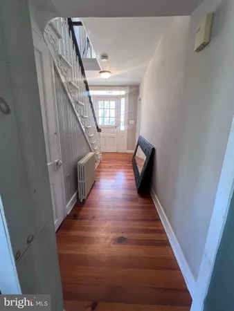 a view of entryway with wooden floor