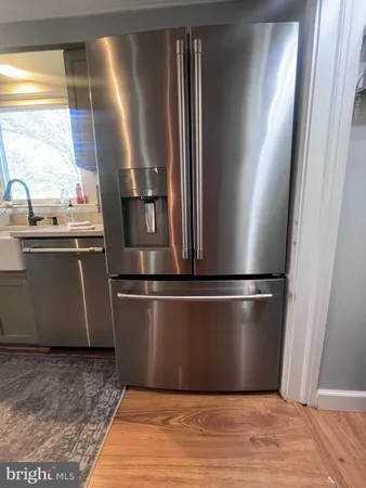 a refrigerator freezer sitting inside of a kitchen