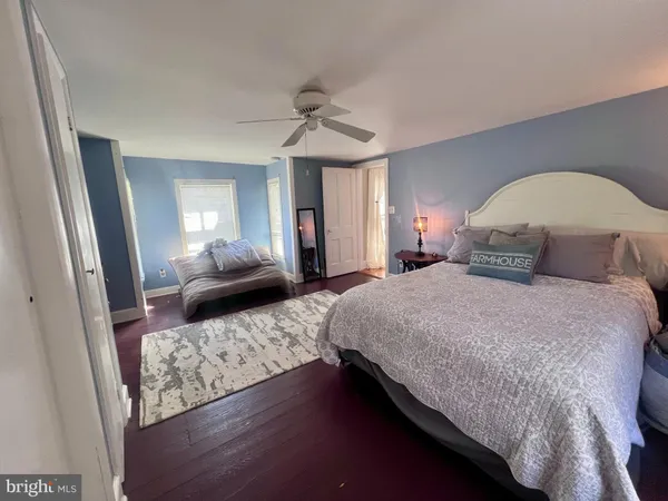 a bedroom with bed and window