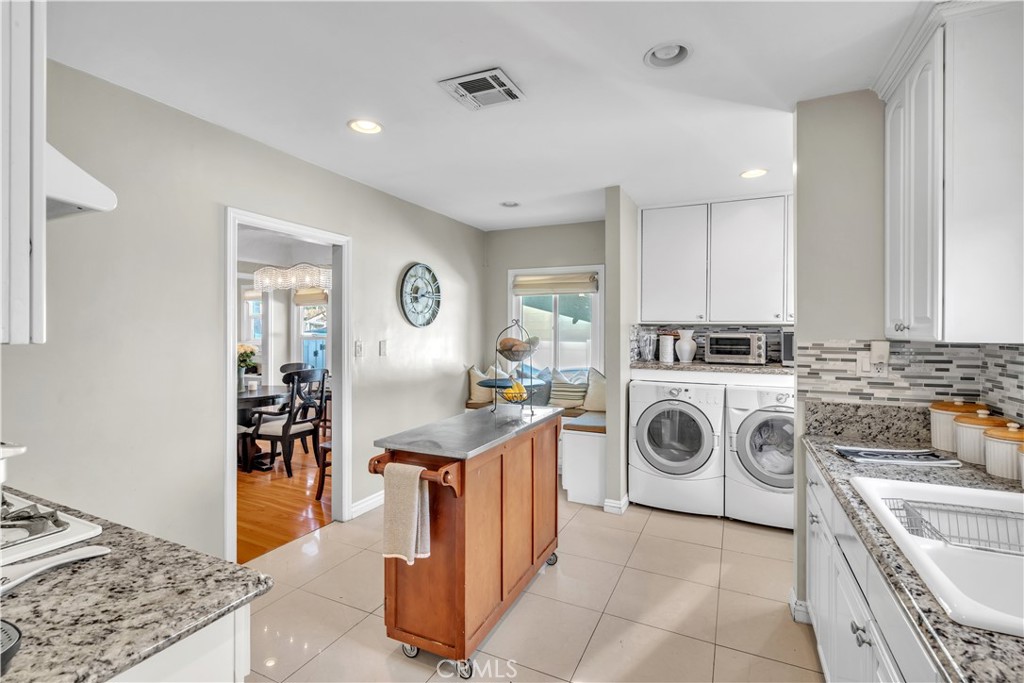 630 King Street Monrovia, CA 91016 - Photo 13 of 22 a kitchen with a stove top oven sink and cabinets