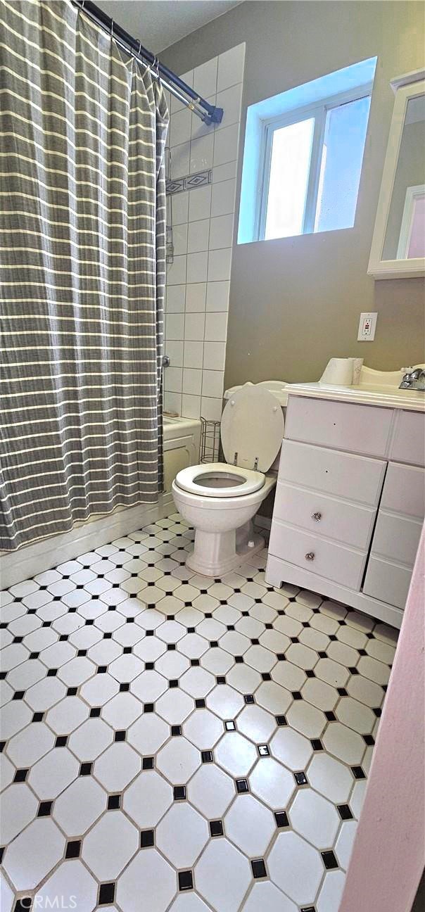 630 King Street Monrovia, CA 91016 - Photo 22 of 22 a bathroom with a toilet a sink and a mirror