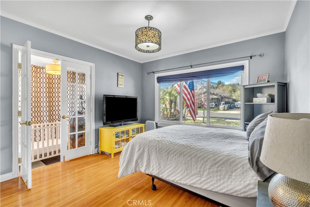 630 King Street Monrovia, CA 91016 - Photo 6 of 22 a bedroom with a bed and glass window