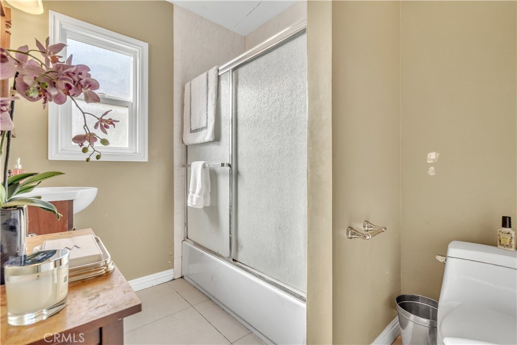 630 King Street Monrovia, CA 91016 - Photo 8 of 22 a bathroom with a shower and a toilet