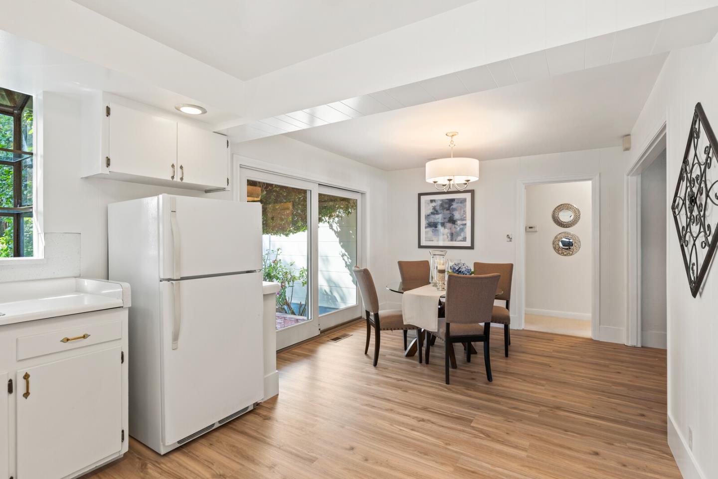 225 Victoria Road Burlingame, CA 94010 - Photo 14 of 29 a view of a dining room with furniture and wooden floor