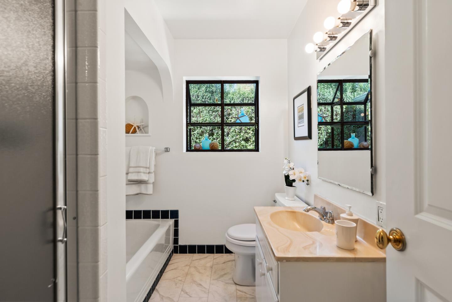225 Victoria Road Burlingame, CA 94010 - Photo 22 of 29 a bathroom with a sink and a mirror