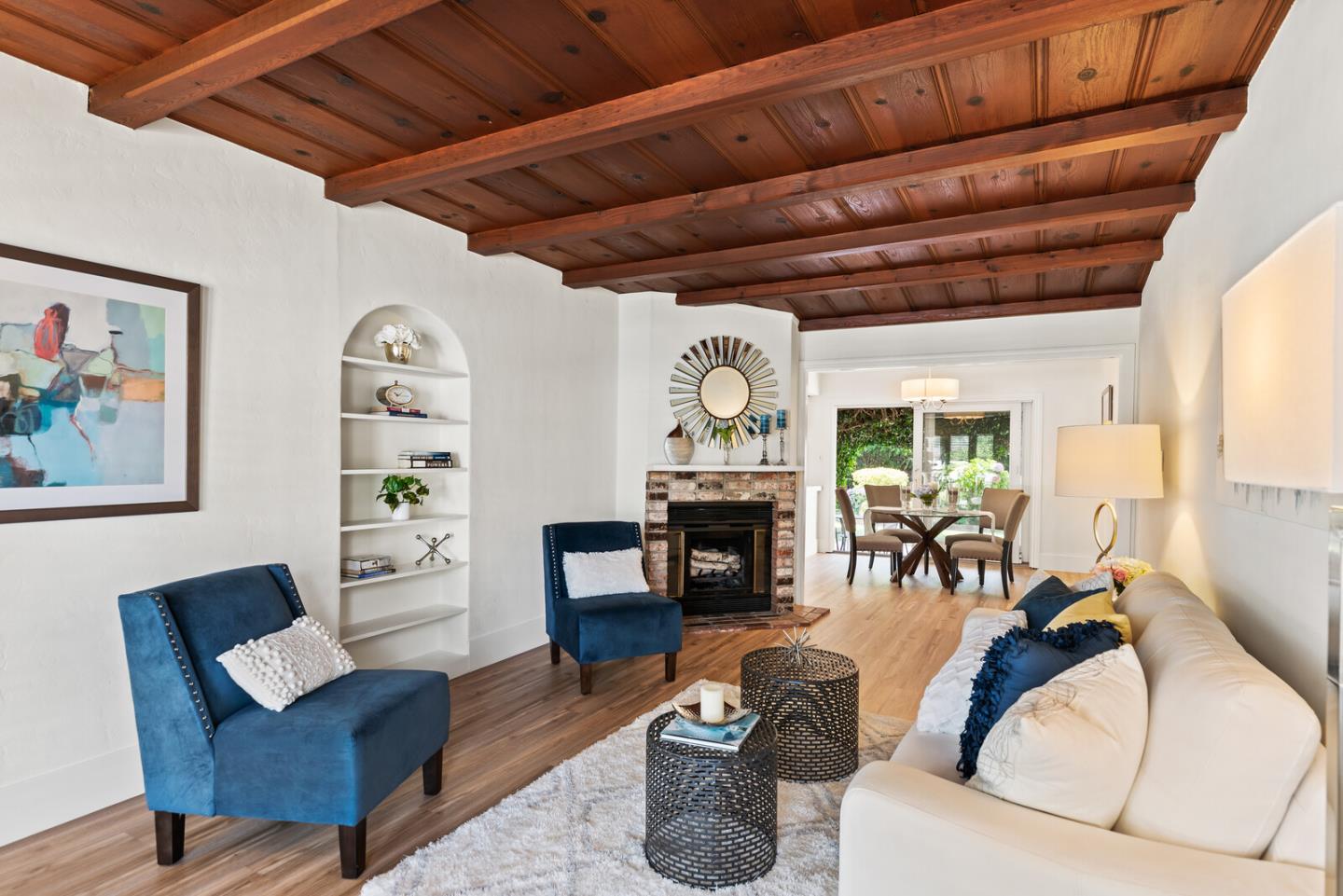 225 Victoria Road Burlingame, CA 94010 - Photo 6 of 29 a living room with furniture a fireplace and a table