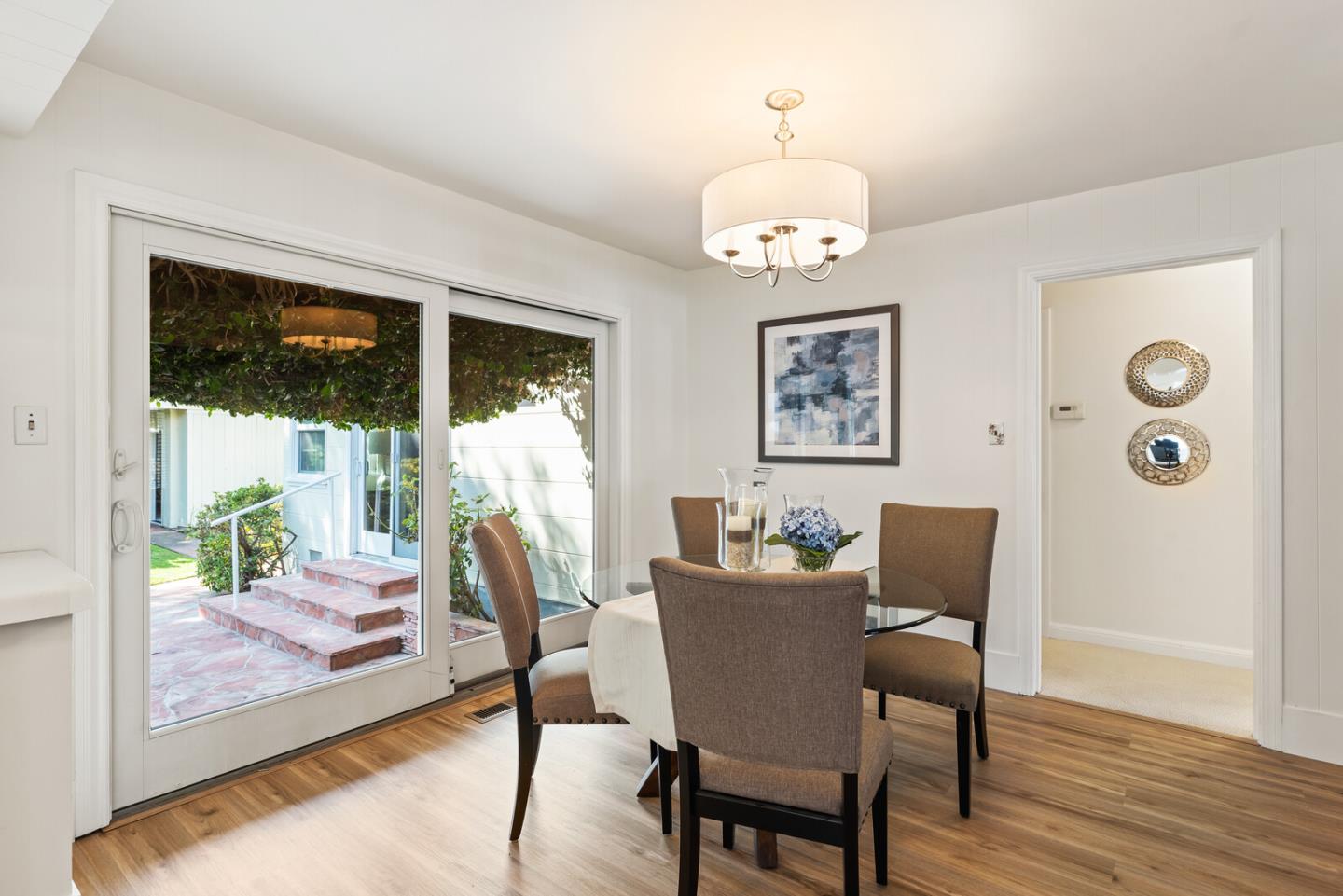 225 Victoria Road Burlingame, CA 94010 - Photo 9 of 29 a view of a dining room with furniture window and wooden floor