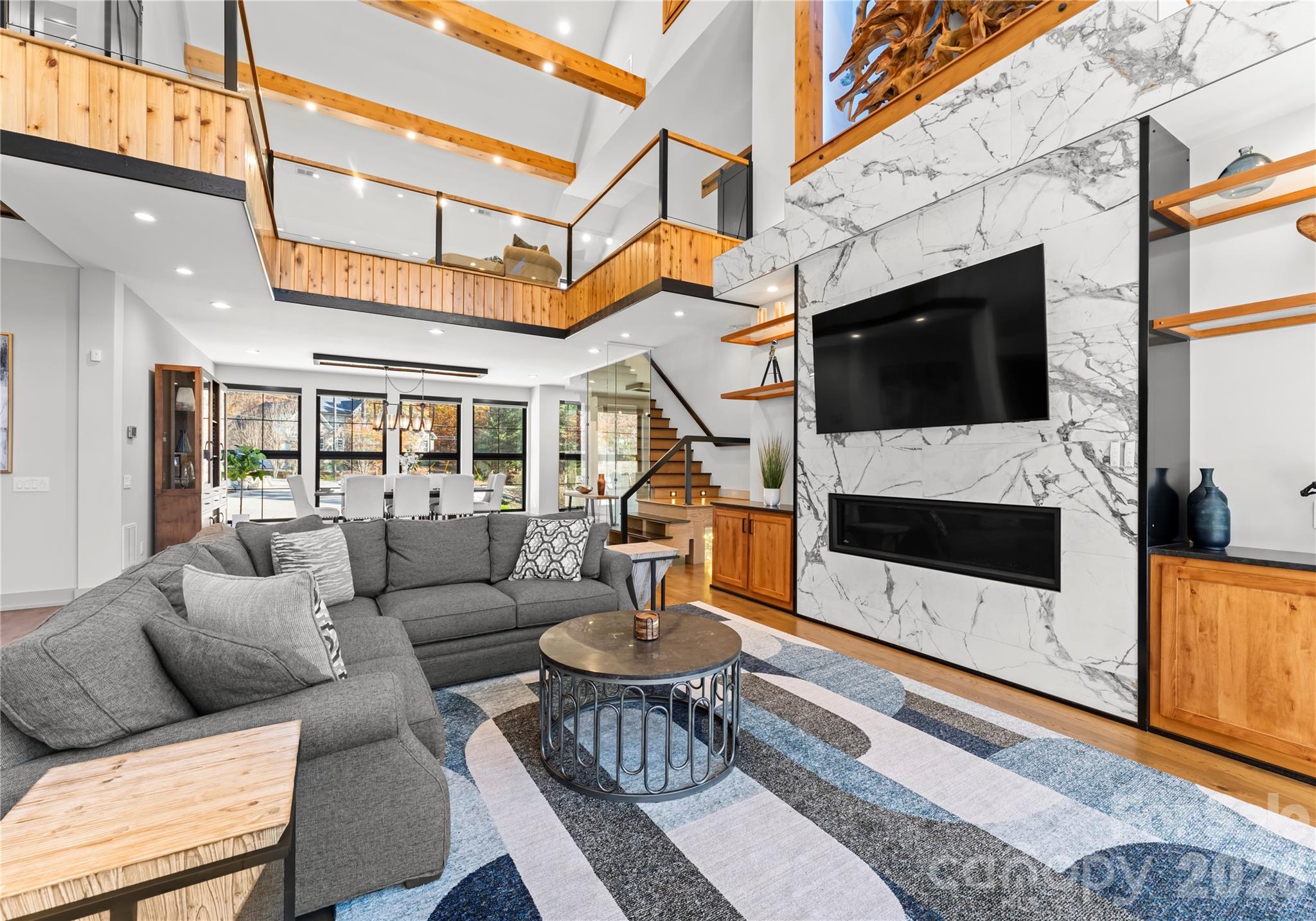 222 Greenbay Road Mooresville, NC 28117 - Photo 11 of 40 a living room with furniture a flat screen tv and a fireplace