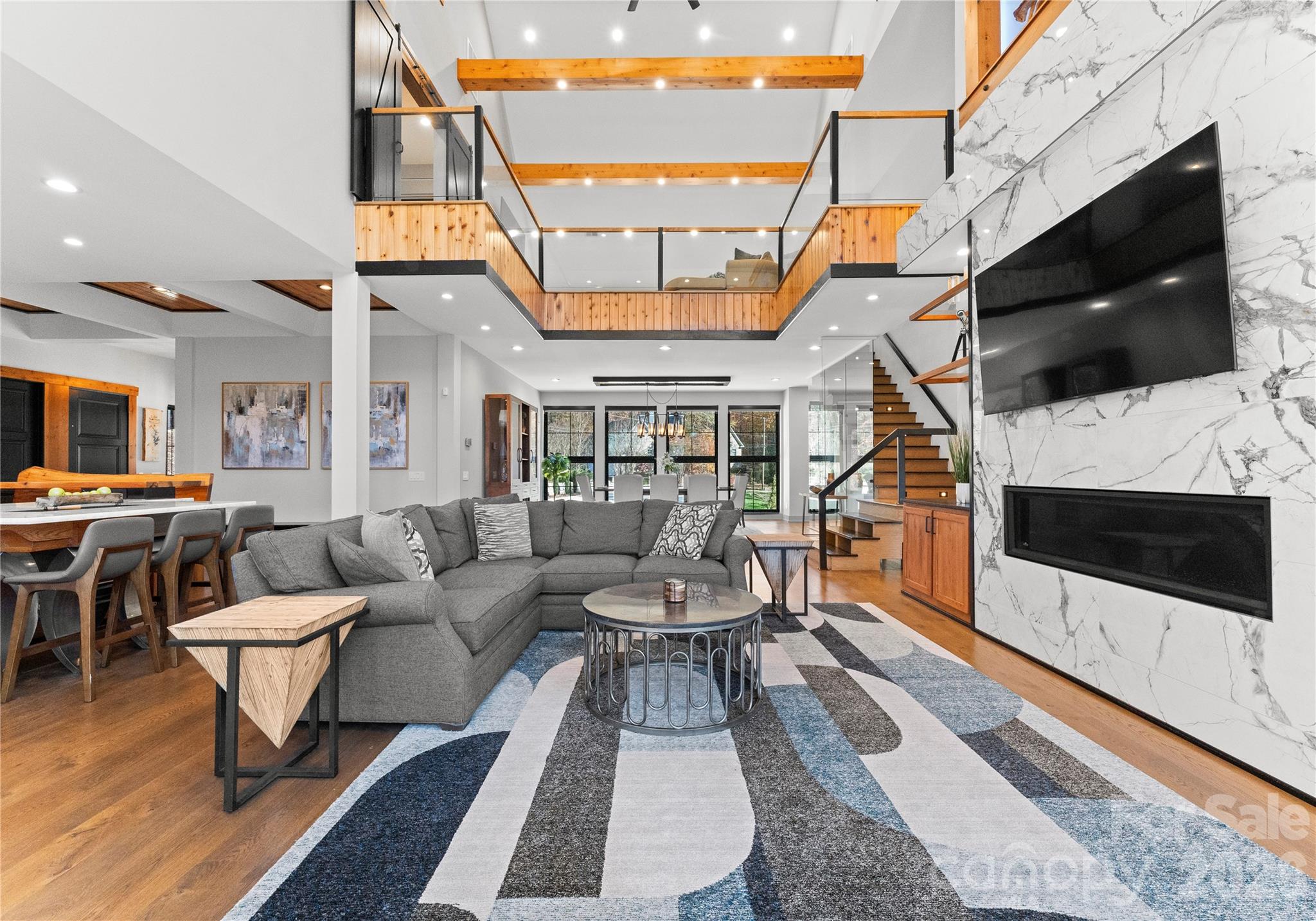222 Greenbay Road Mooresville, NC 28117 - Photo 12 of 40 a living room with furniture a flat screen tv and a fireplace