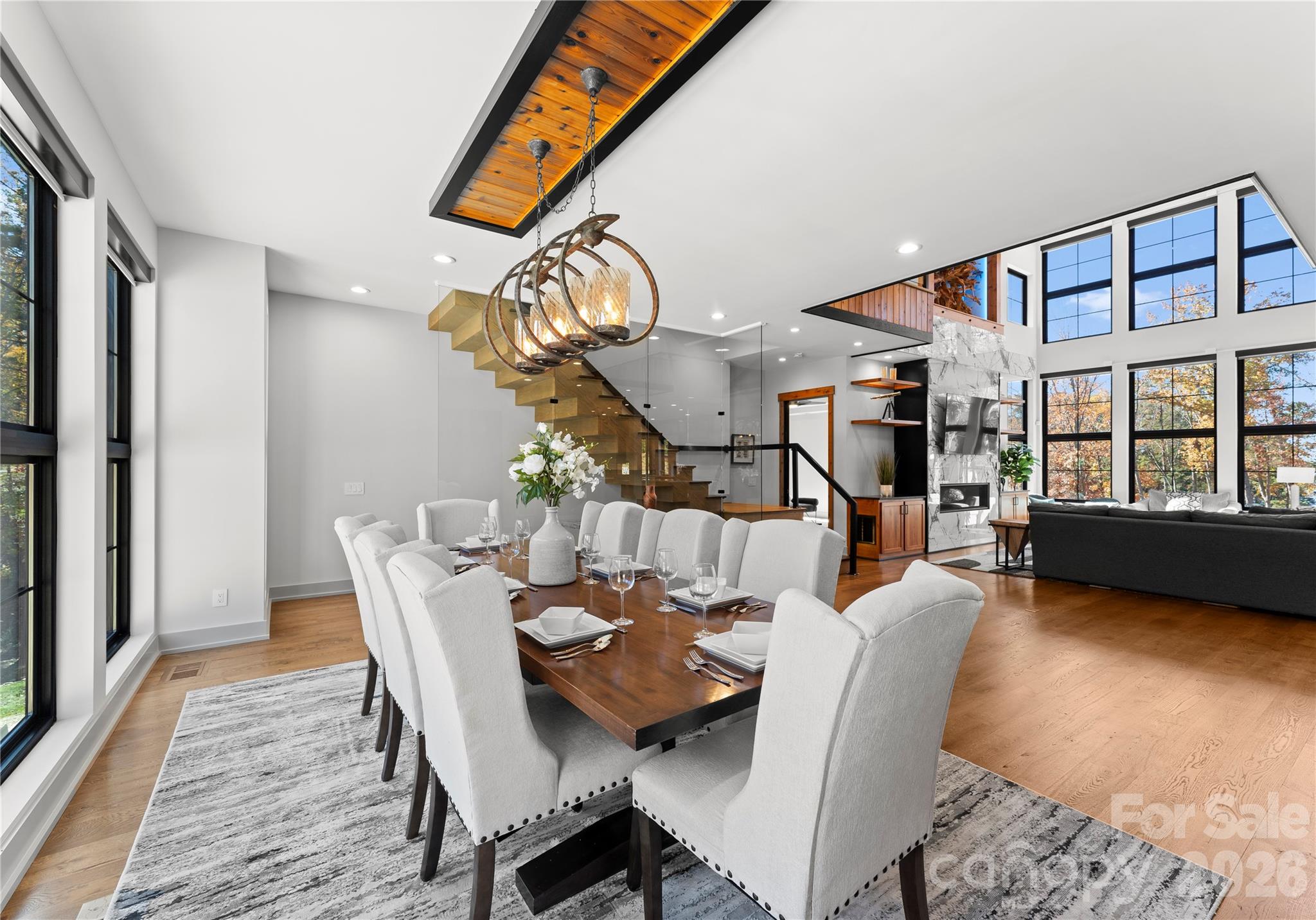 222 Greenbay Road Mooresville, NC 28117 - Photo 14 of 40 a view of a dining room with furniture and a floor to ceiling window