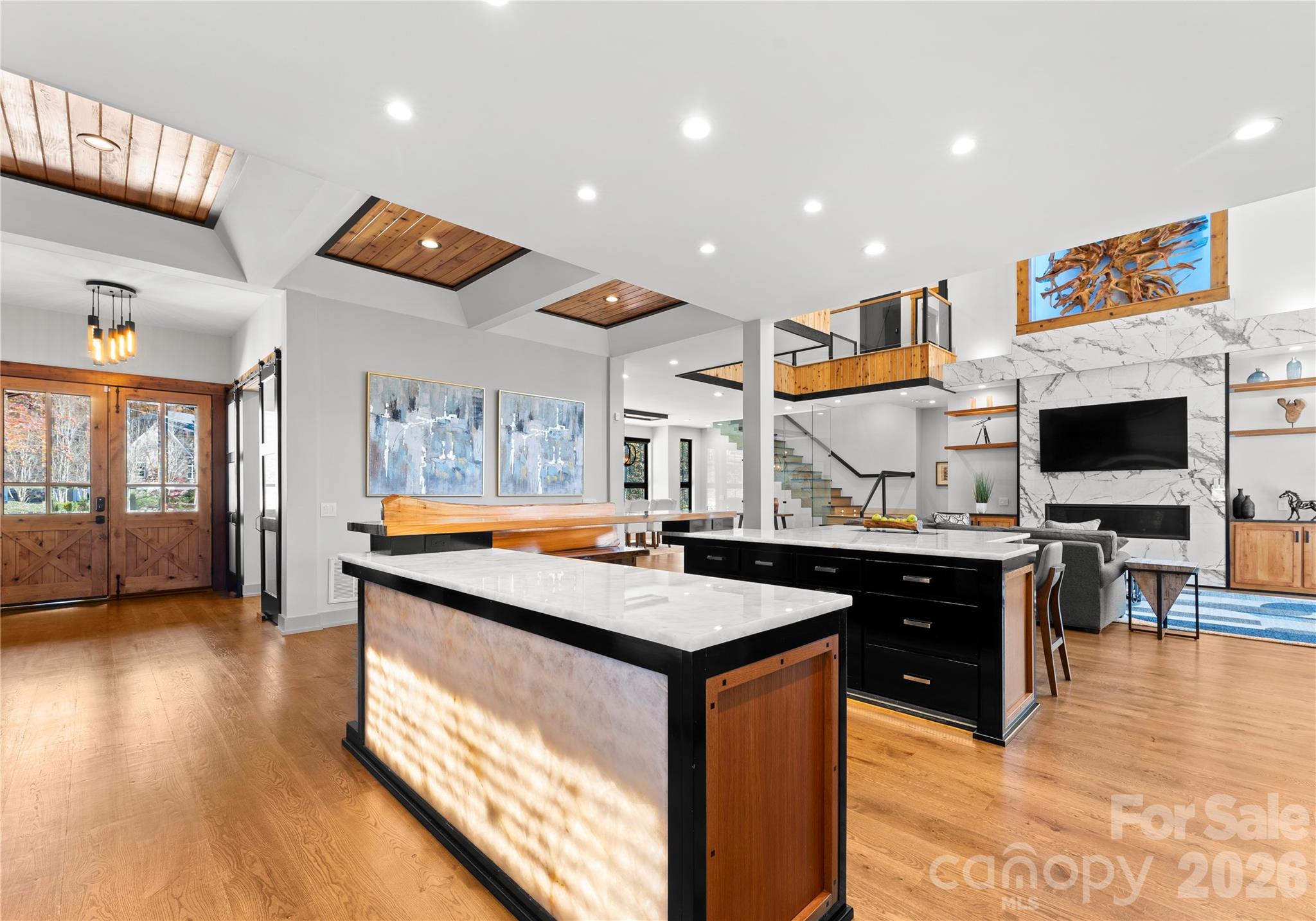 222 Greenbay Road Mooresville, NC 28117 - Photo 19 of 40 a kitchen with stainless steel appliances granite countertop a stove and a view of living room