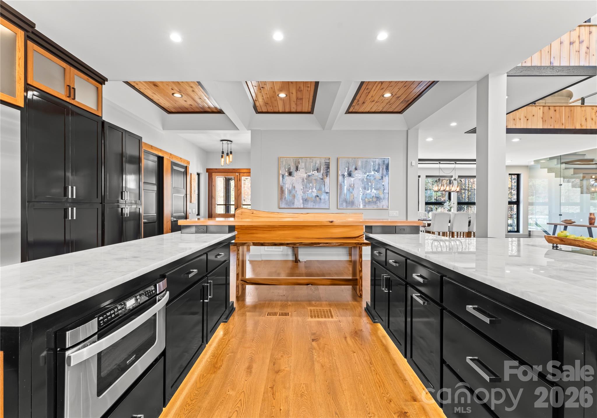 222 Greenbay Road Mooresville, NC 28117 - Photo 22 of 40 a large kitchen with stainless steel appliances granite countertop a lot of counter space and a sink
