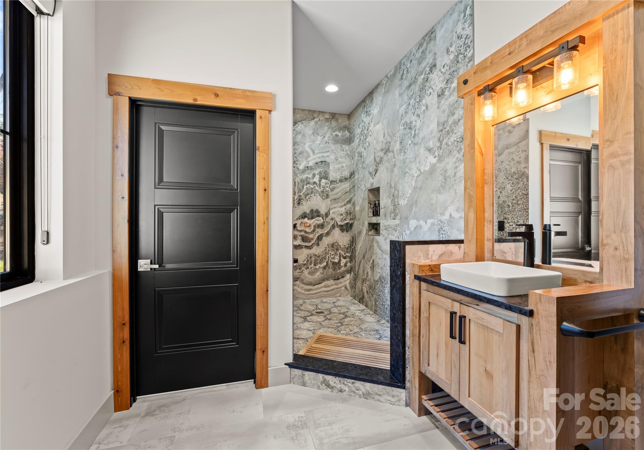 222 Greenbay Road Mooresville, NC 28117 - Photo 32 of 40 a bathroom with a granite countertop sink and a mirror