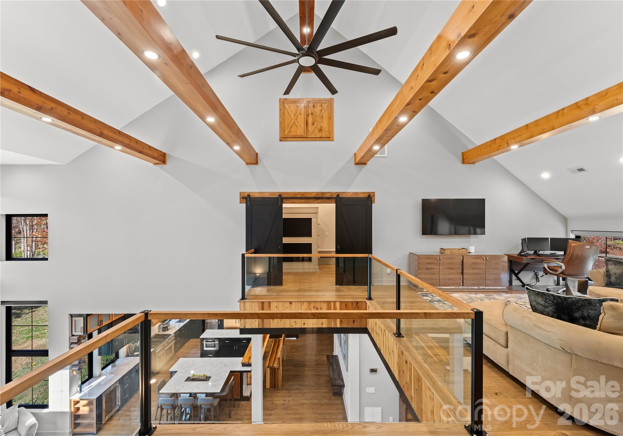 222 Greenbay Road Mooresville, NC 28117 - Photo 33 of 40 a living room with furniture flat screen tv and a table