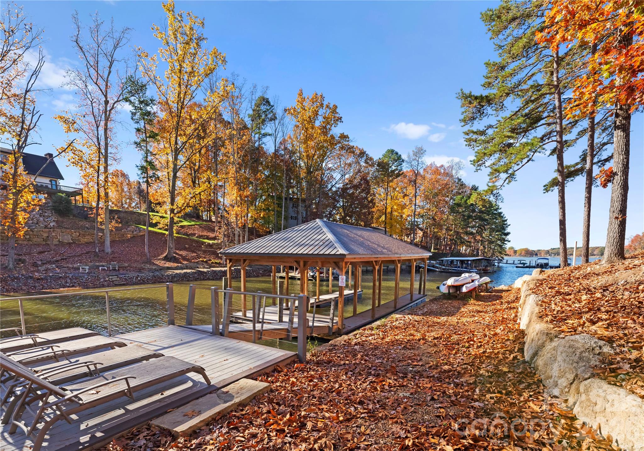 222 Greenbay Road Mooresville, NC 28117 - Photo 7 of 40 a patio with table and chairs and a barbeque