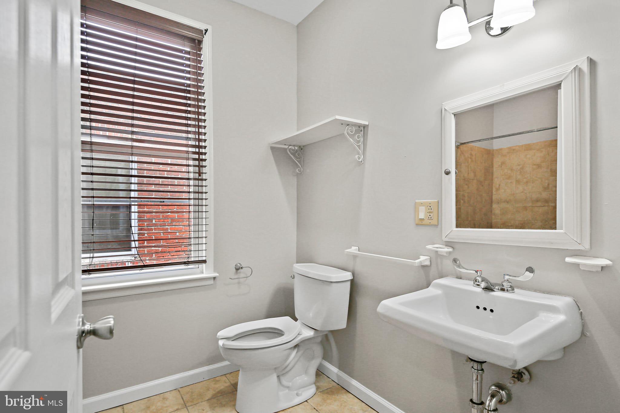 3924 Reisterstown Road Baltimore, MD 21215 - Photo 11 of 25 Bright and airy bathroom with modern fixtures.