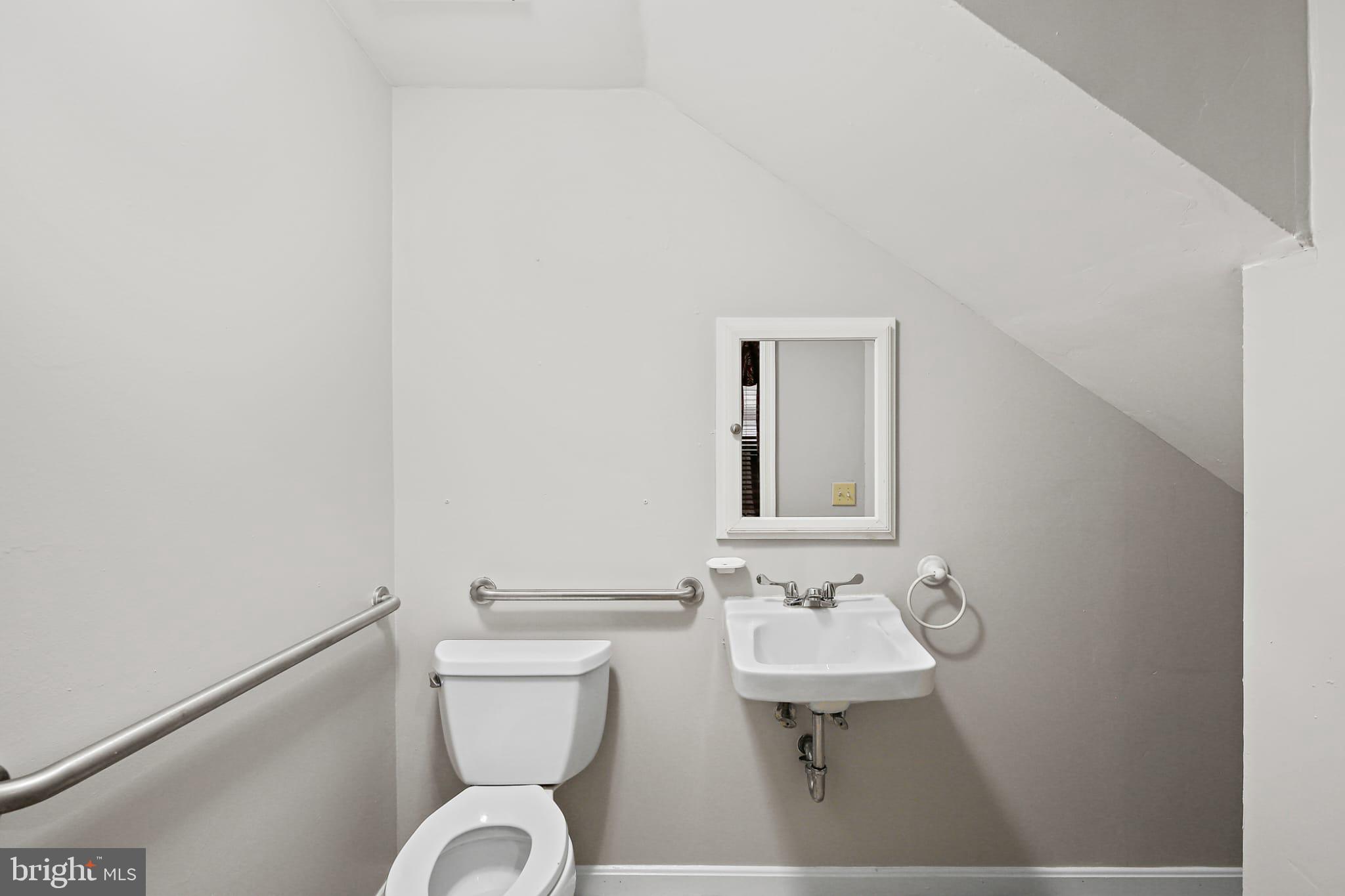 3924 Reisterstown Road Baltimore, MD 21215 - Photo 15 of 25 Compact bathroom with modern amenities.