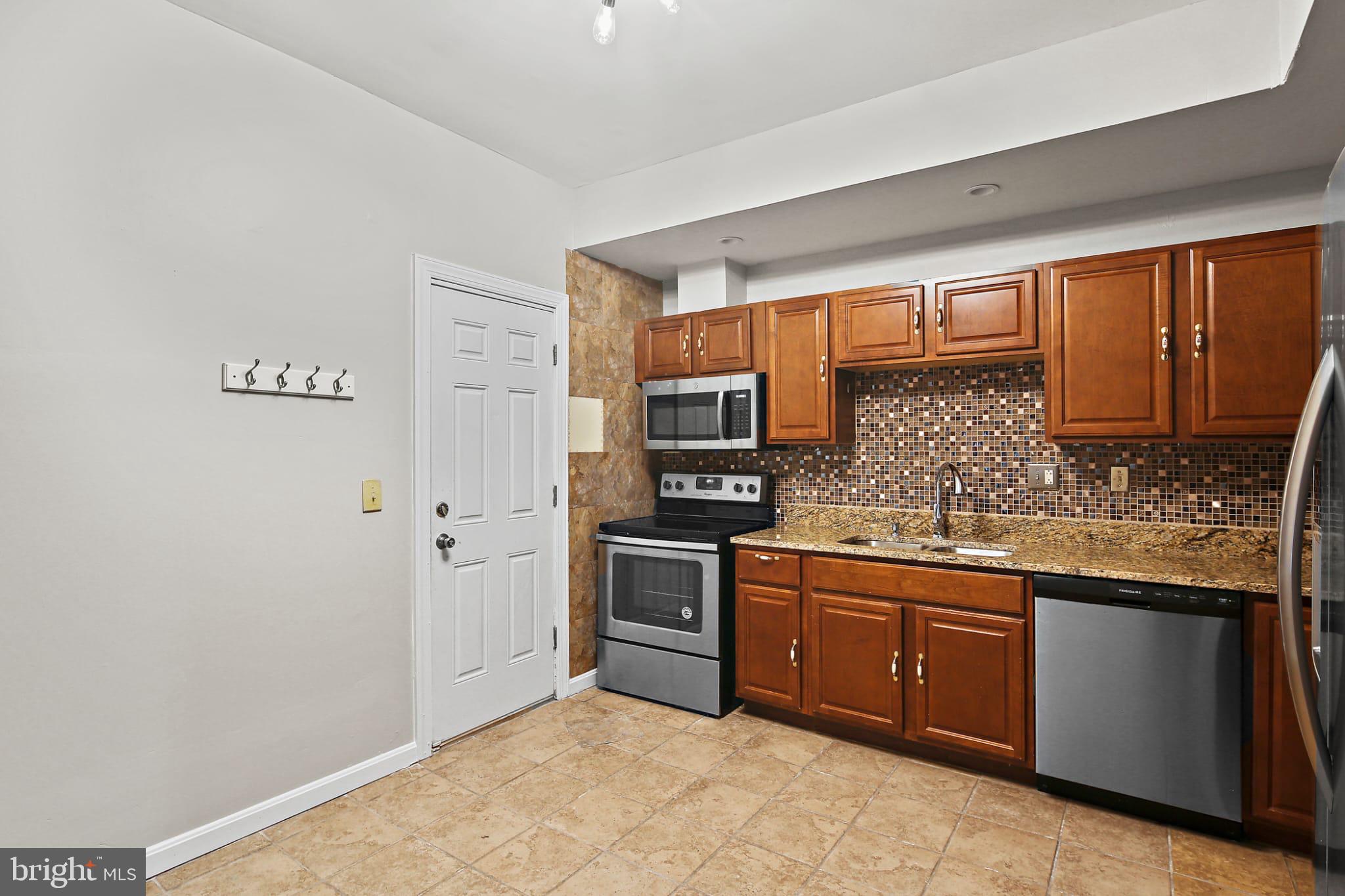 3924 Reisterstown Road Baltimore, MD 21215 - Photo 8 of 25 Modern kitchen with stylish cabinetry.