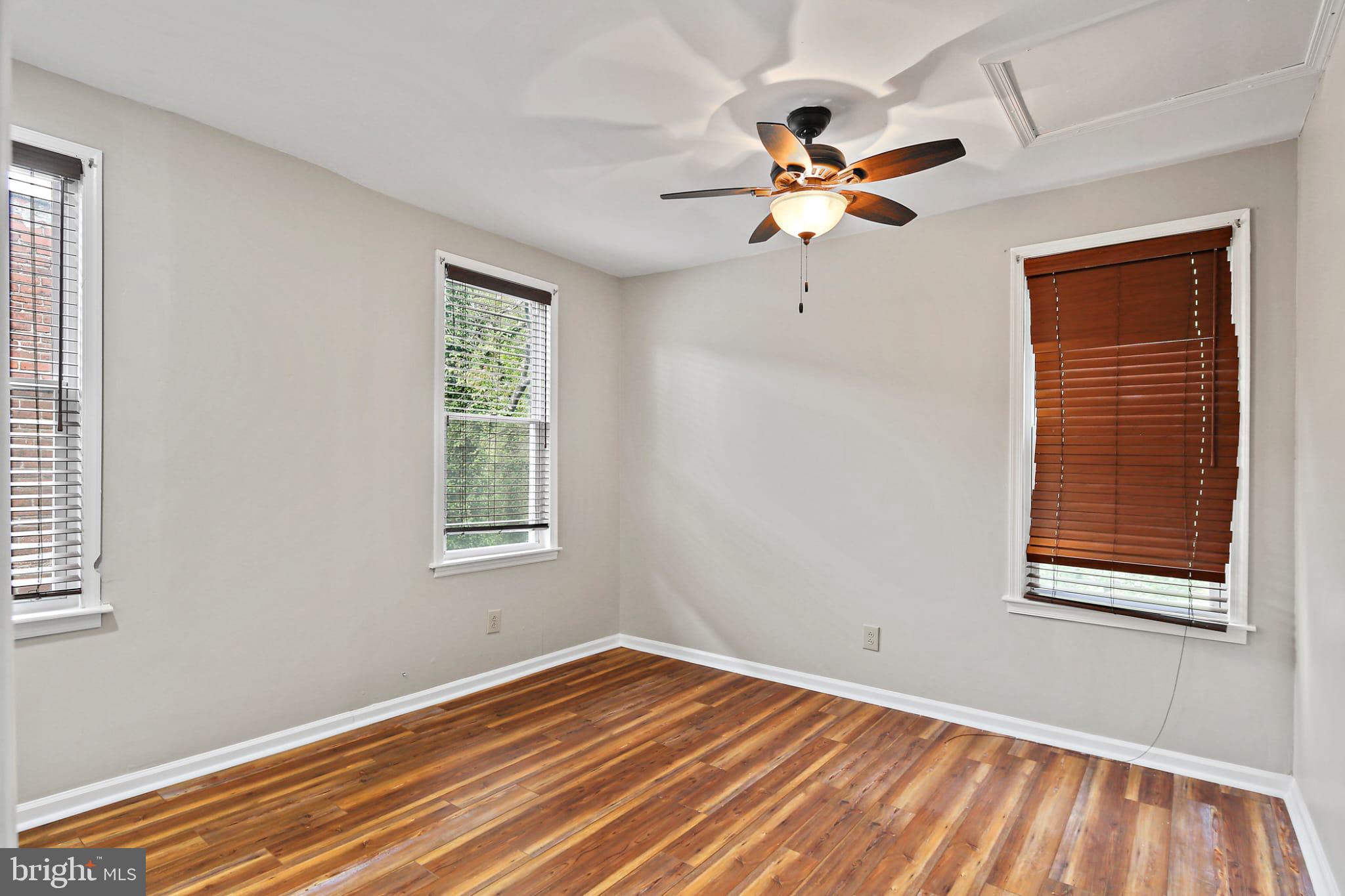 3924 Reisterstown Road Baltimore, MD 21215 - Photo 10 of 25 Bright and airy room with warm wood floors.