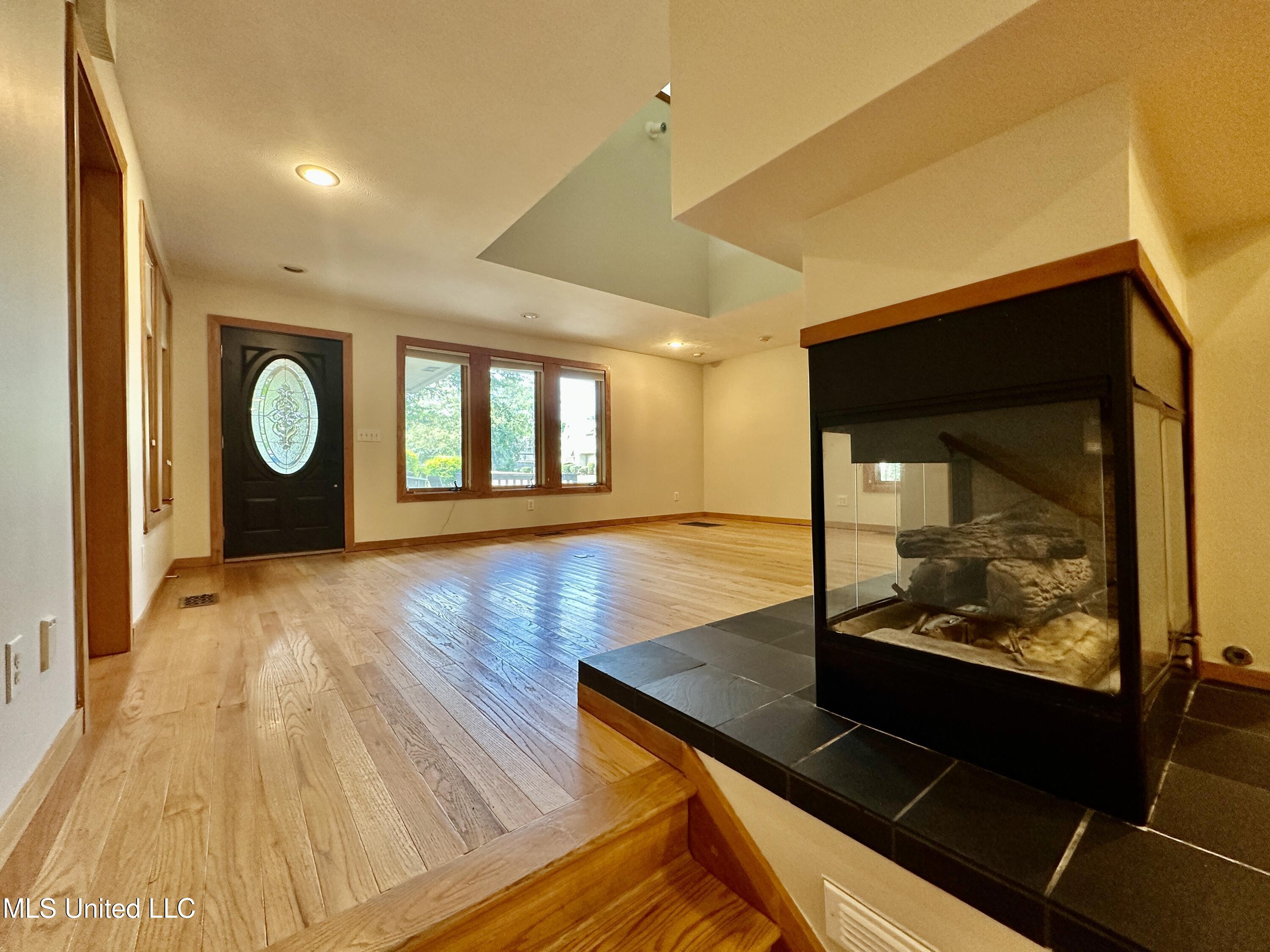 211 Monterey Drive Clinton, MS 39056 - Photo 6 of 62 family room to front door