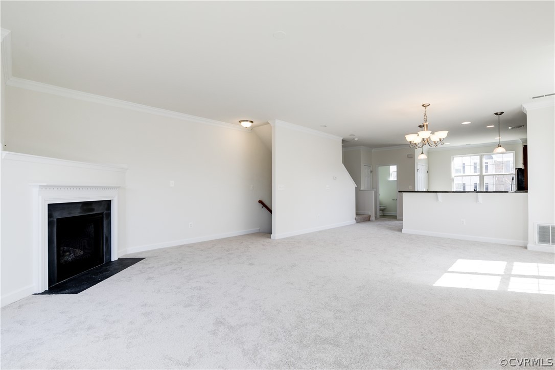 13346 Diamond Ridge Drive Midlothian, VA 23112 - Photo 11 of 42 an empty room with a fireplace and kitchen view