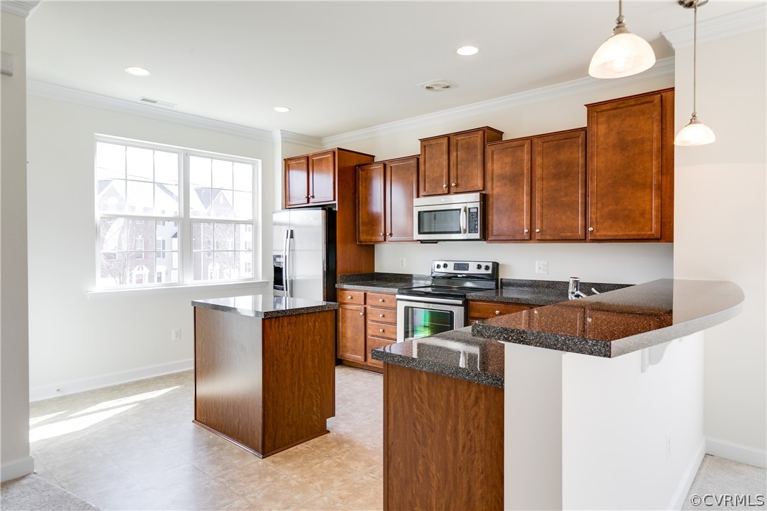 13346 Diamond Ridge Drive Midlothian, VA 23112 - Photo 17 of 42 a kitchen with stainless steel appliances granite countertop a stove a sink a refrigerator white cabinets and a microwave