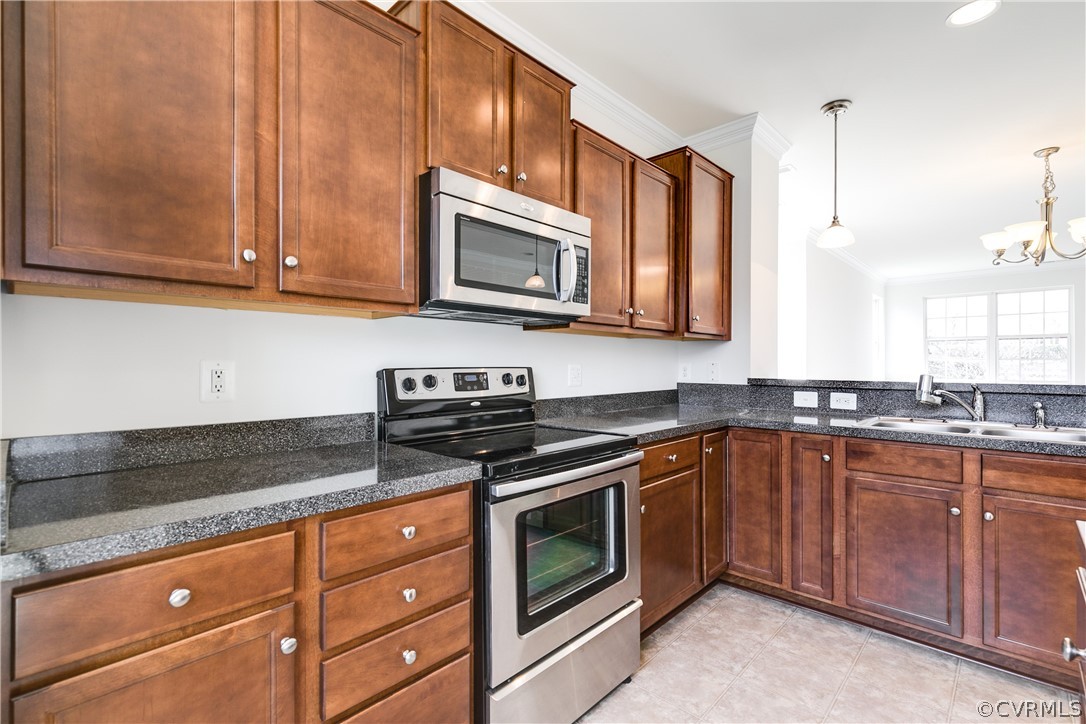 13346 Diamond Ridge Drive Midlothian, VA 23112 - Photo 19 of 42 a kitchen with stainless steel appliances granite countertop a sink stove and microwave