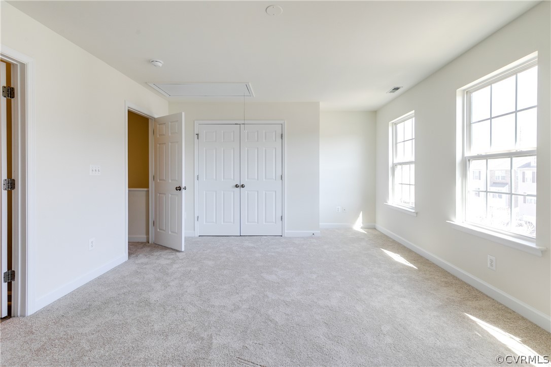 13346 Diamond Ridge Drive Midlothian, VA 23112 - Photo 32 of 42 an empty room with windows and closet