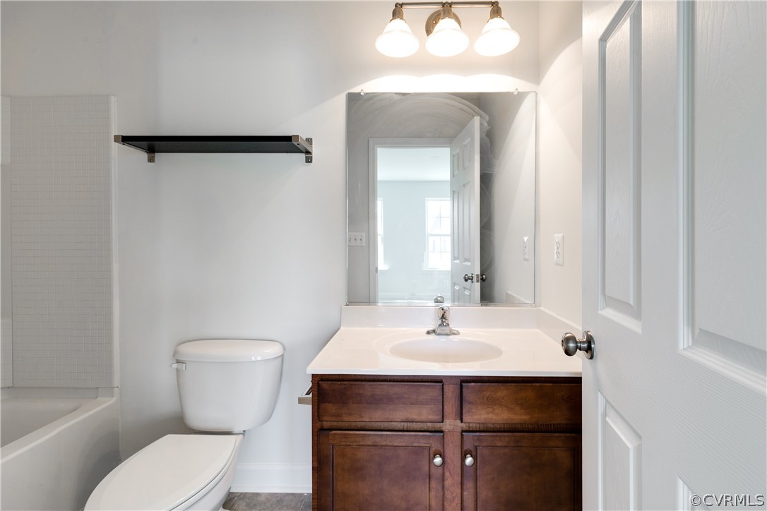 13346 Diamond Ridge Drive Midlothian, VA 23112 - Photo 34 of 42 a bathroom with a toilet sink and mirror