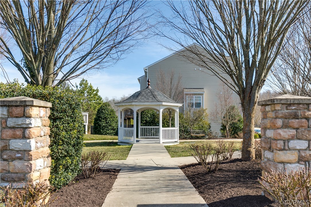 13346 Diamond Ridge Drive Midlothian, VA 23112 - Photo 40 of 42 a front view of a house with a garden