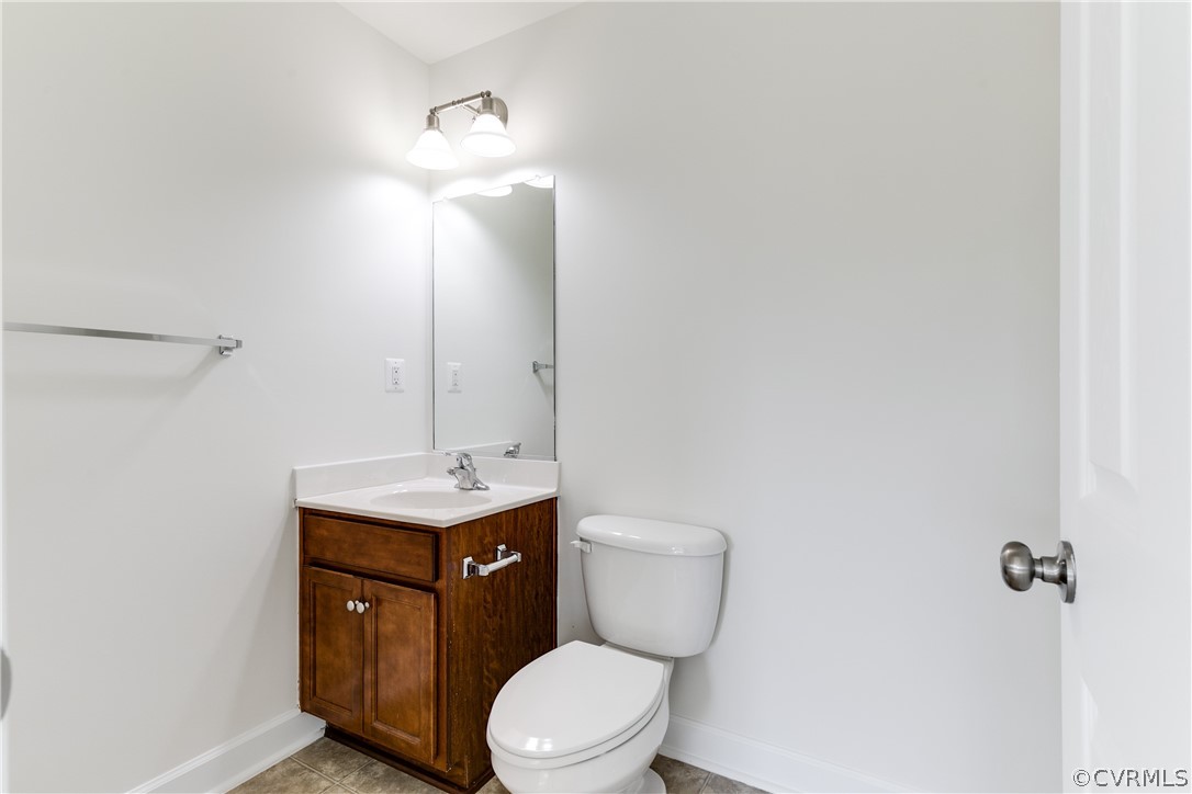 13346 Diamond Ridge Drive Midlothian, VA 23112 - Photo 9 of 42 a bathroom with a toilet a sink and mirror