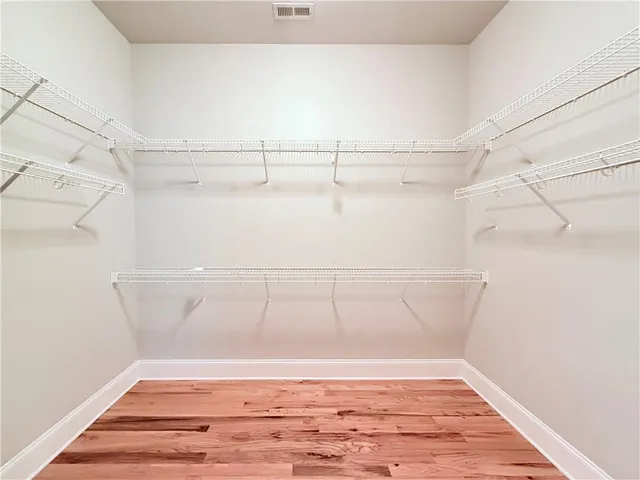 a view of a room with racks on the wall