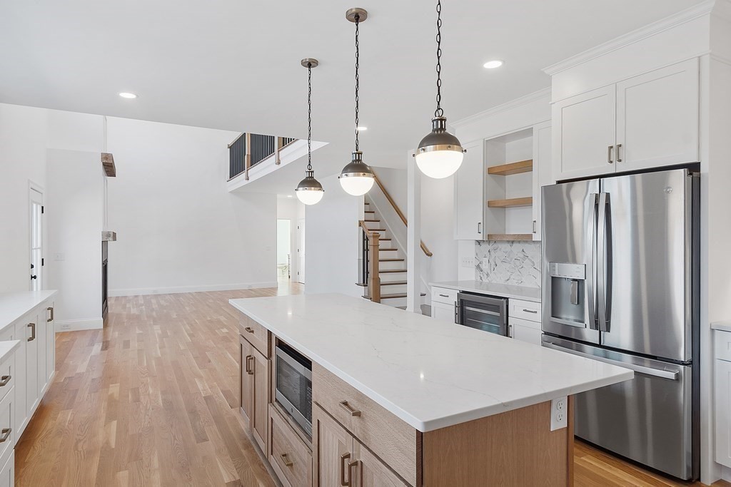 129 Brown Road Harvard, MA 01451 - Photo 12 of 40 a kitchen with stainless steel appliances a refrigerator a sink and a stove