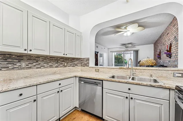 a kitchen with a sink and cabinets