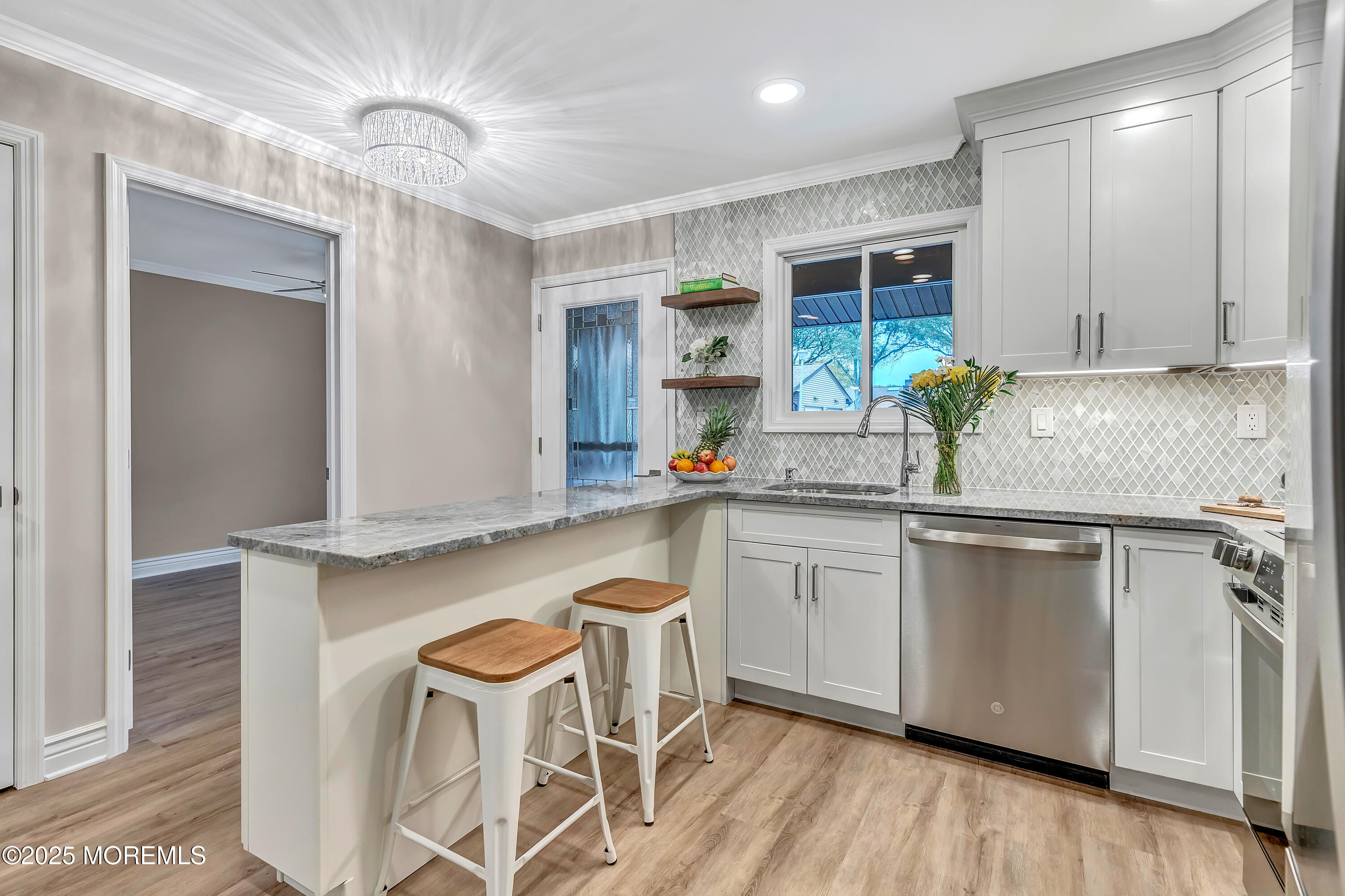 10 Ellsworth Court Red Bank, NJ 07701 - Photo 11 of 40 a kitchen with granite countertop white cabinets and stainless steel appliances