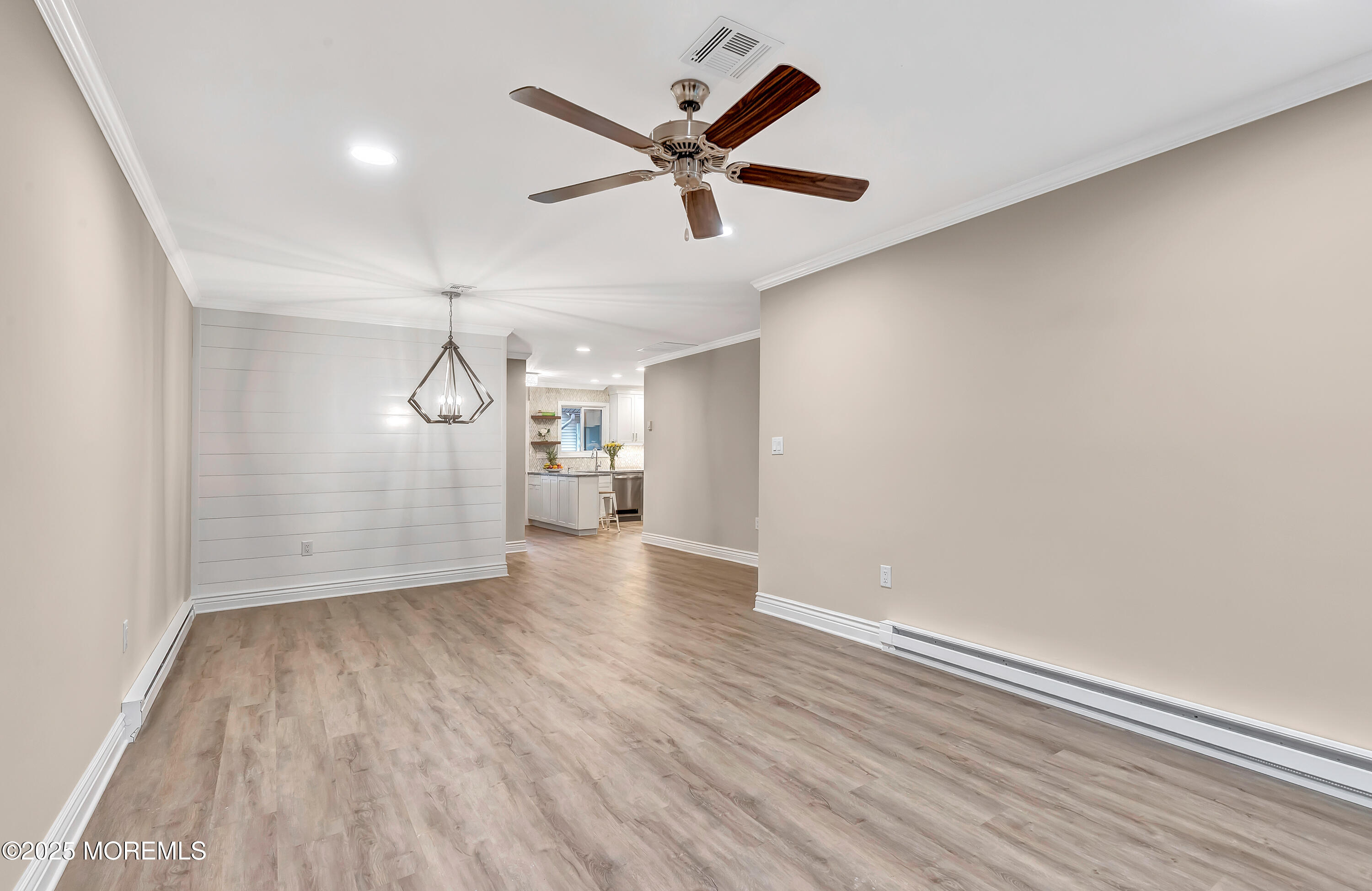 10 Ellsworth Court Red Bank, NJ 07701 - Photo 19 of 40 an empty room with wooden floor and windows