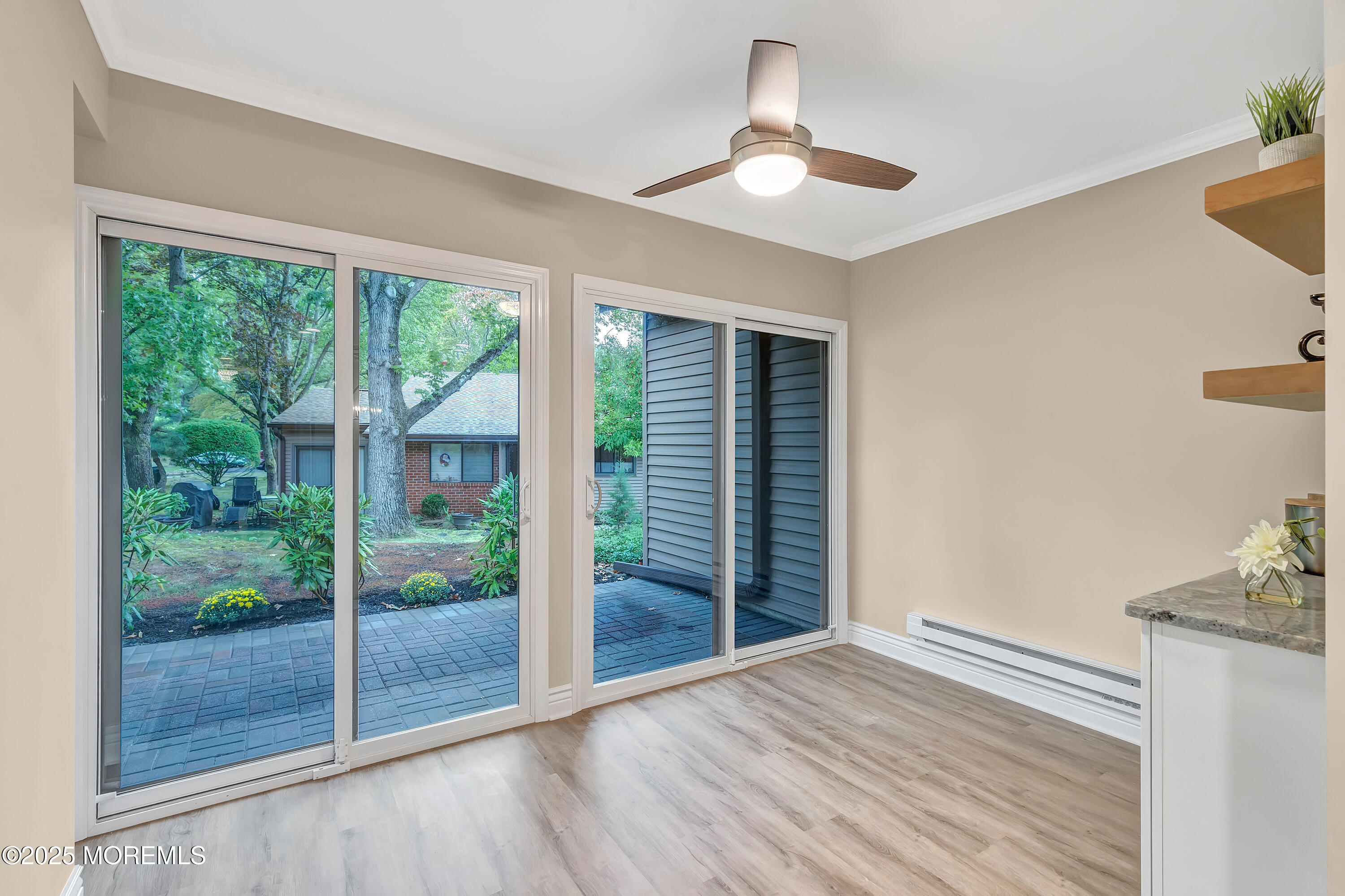 10 Ellsworth Court Red Bank, NJ 07701 - Photo 21 of 40 a view of empty room with wooden floor and fan