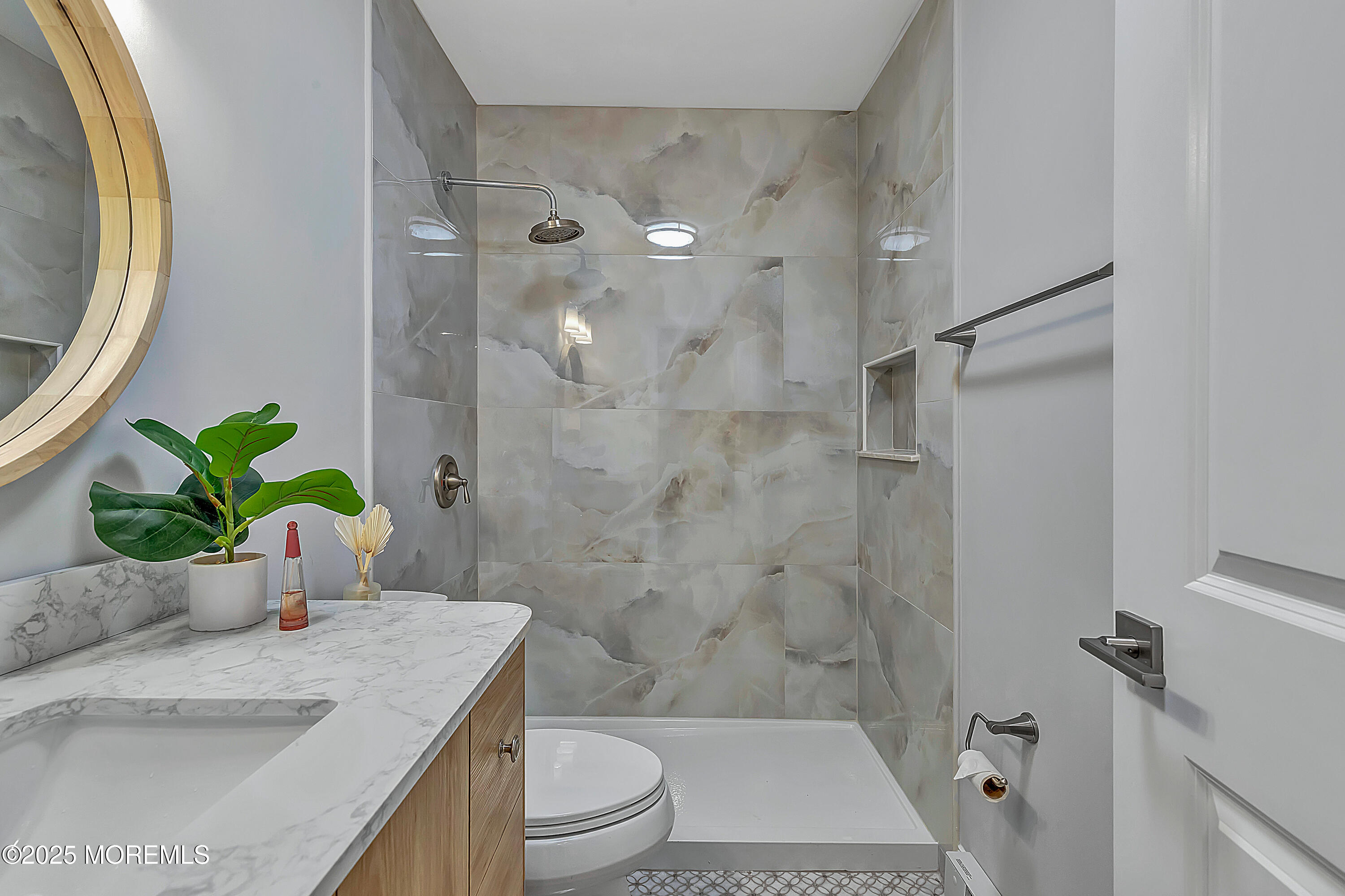10 Ellsworth Court Red Bank, NJ 07701 - Photo 25 of 40 a bathroom with a granite countertop sink a toilet and shower