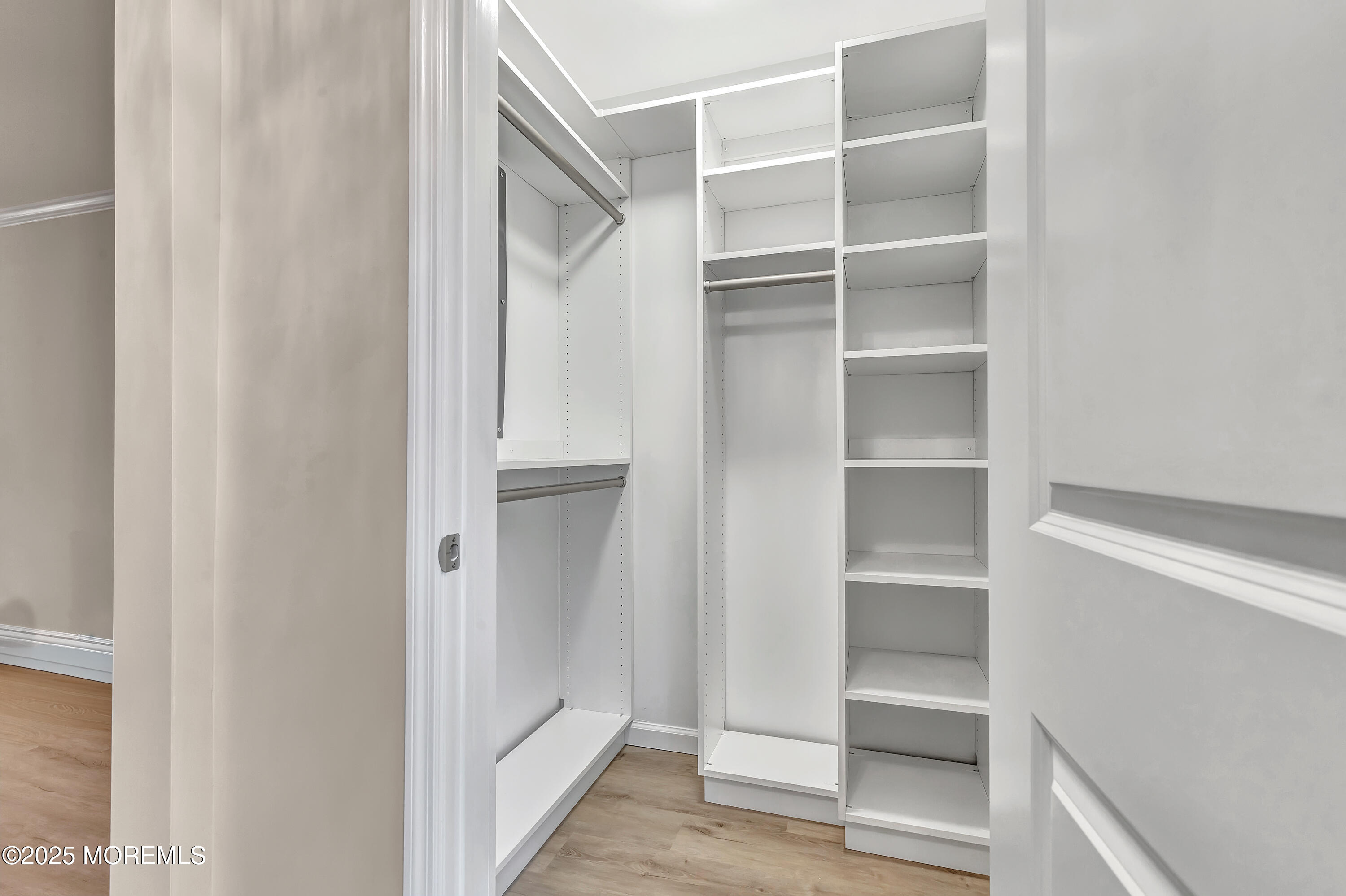 10 Ellsworth Court Red Bank, NJ 07701 - Photo 28 of 40 a view of walk in closet with empty racks