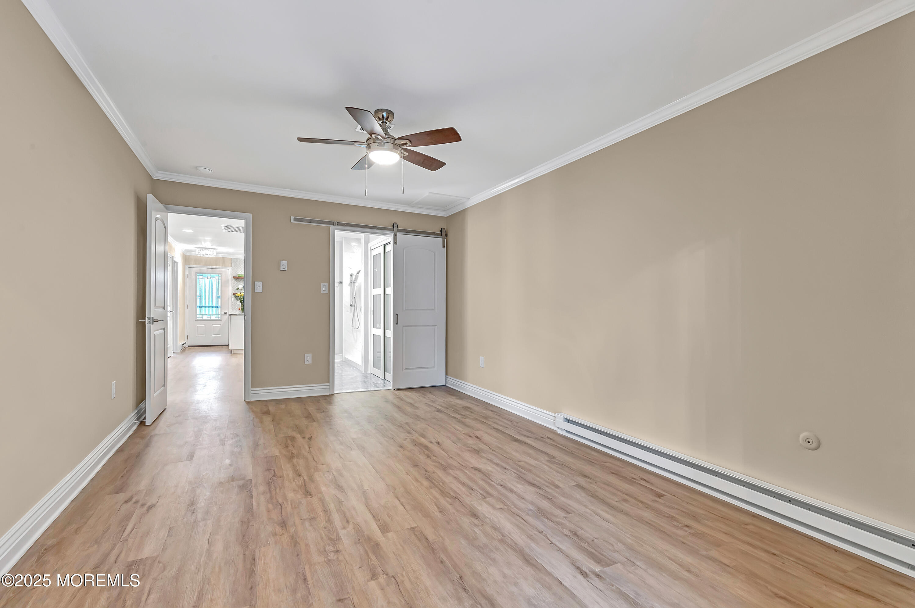 10 Ellsworth Court Red Bank, NJ 07701 - Photo 29 of 40 a view of an empty room with wooden floor and a window