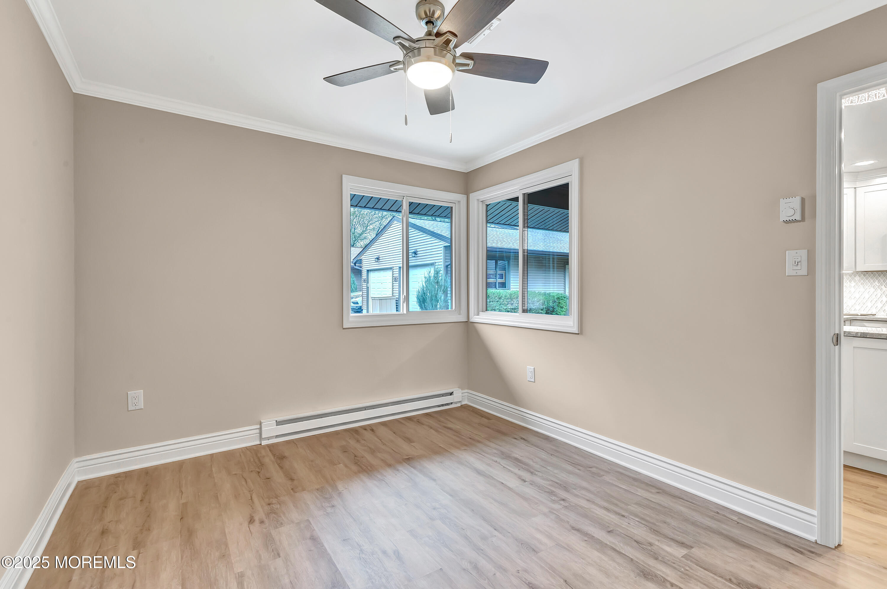 10 Ellsworth Court Red Bank, NJ 07701 - Photo 34 of 40 an empty room with wooden floor and windows