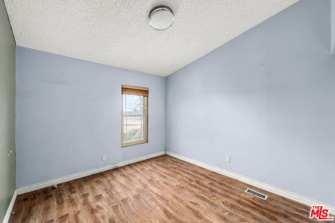 6425 Smoke Tree Road Phelan, CA 92371 - Photo 18 of 35 a view of empty room with window