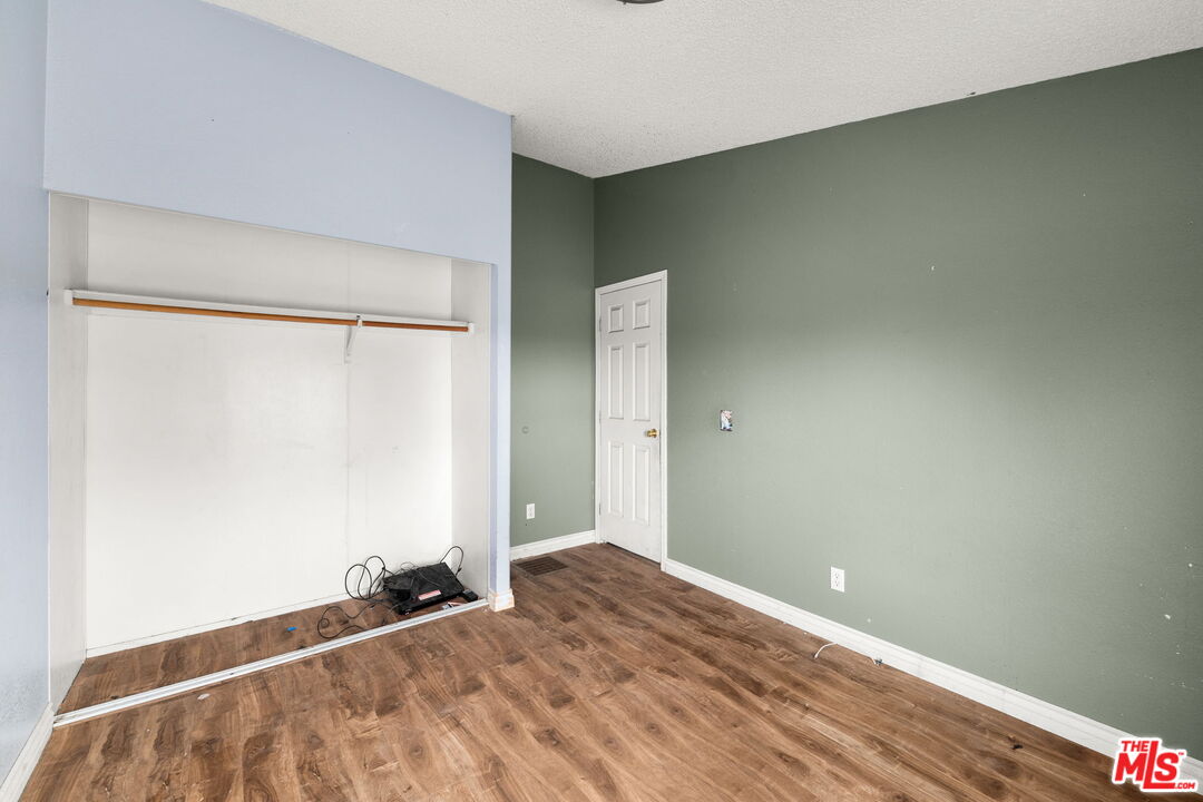 6425 Smoke Tree Road Phelan, CA 92371 - Photo 19 of 35 a view of a room with wooden floor