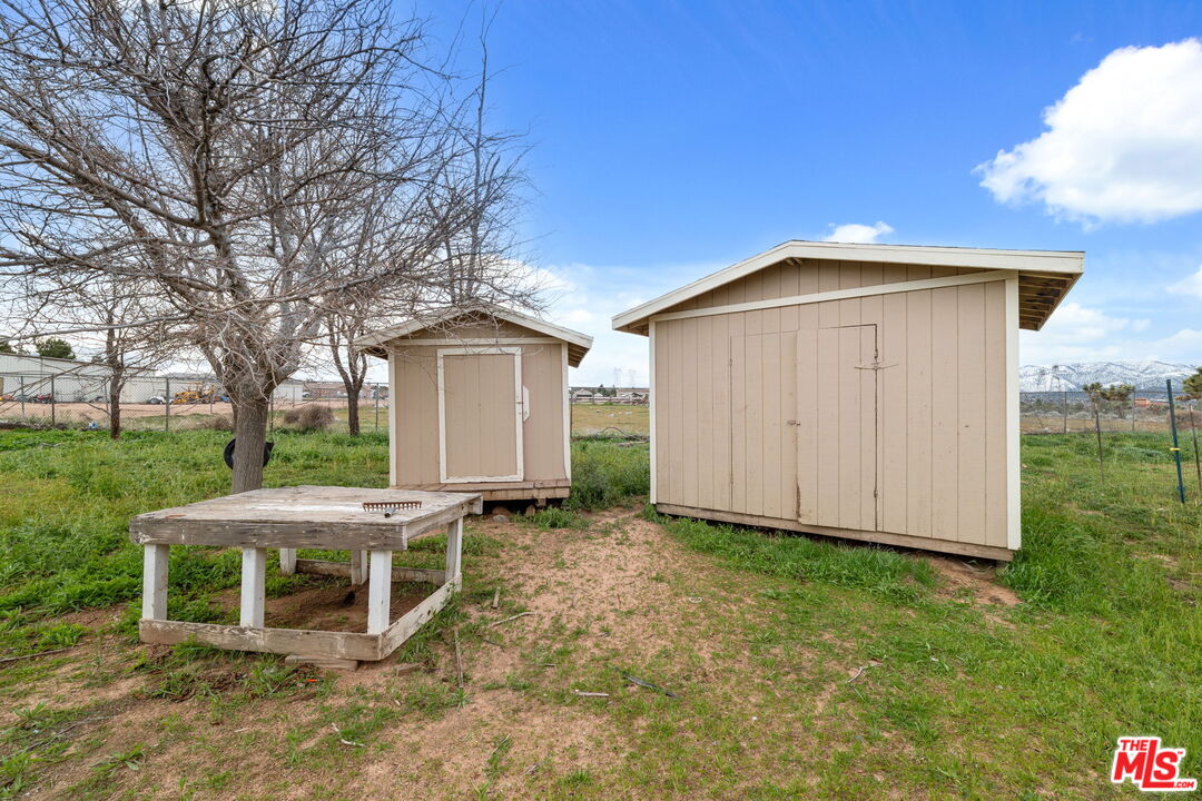 6425 Smoke Tree Road Phelan, CA 92371 - Photo 24 of 35 a front view of a house with garden